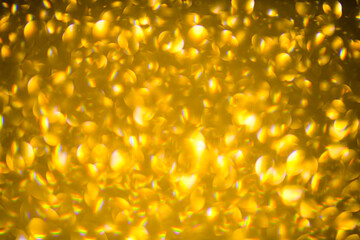Gold glitter Sparkle Texture. New Year background. Glitter background. Christmas Sparkle bokeh....