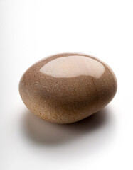 Small stones with smooth surfaces on a plain white background