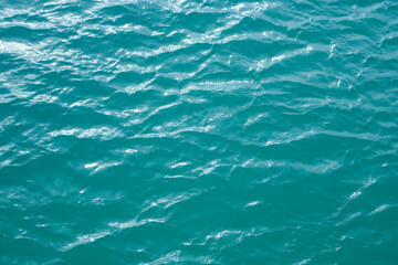 Ocean surface. Blue water texture. Close up blue water surface. Sea surface aerial view. Blue ocean surface. Blue water. Pattern texture.