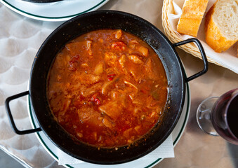 Hot Callos stew - traditional dish of Spanish cuisine. Rich pork tripe broth with vegetables