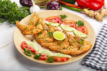 Grilled prawn served lime and vegetables
