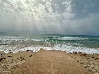 Concrete Path Leading to the Sea on a Cloudy Day
