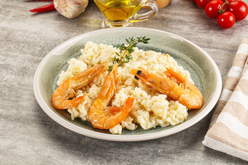 Italian risotto with prawn served thyme