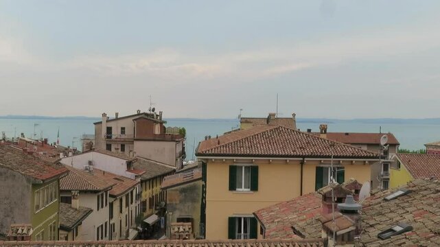 Panoramic rooftop view of a typical Italian village Bardolino at the Garda Lake at golden hour