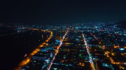 Fototapeta premium Stunning Aerial Night View of a Winter Cityscape in Thailand Under the Starry Sky