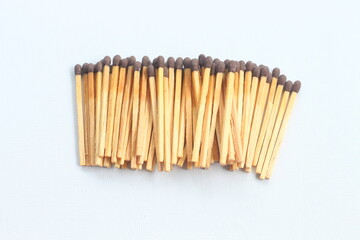 wooden matches with red heads, pile of wooden matches isolated on white background
