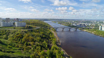 Fototapeta premium City with a river running through it and a bridge over it