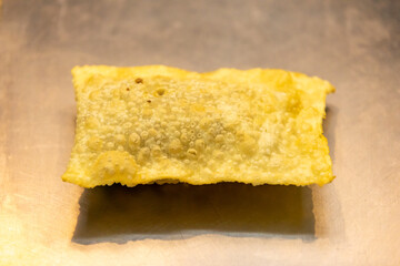 Traditional Brazilian fried pastry stuffed with ground beef. 