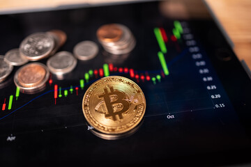 Bitcoin with money on an a tablet