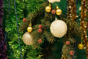 Christmas background with fir twigs, red berries, cones and Xmas lights