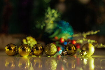 Christmas background with fir twigs, red berries, cones and Xmas lights
