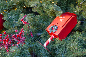 At Christmas, Christmas tree balls and other decorations are used to decorate the Christmas tree. Here, a mailbox for children's wish lists has been hung in red with the inscription Santa MAIL.