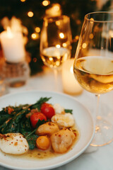 Golden christmas dinner, shining lights, professional photography, warm colors, candles, drinks and food, festive celebration, wine, family get together, xmas