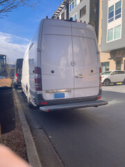 A deliver truck in a residential parking lot
