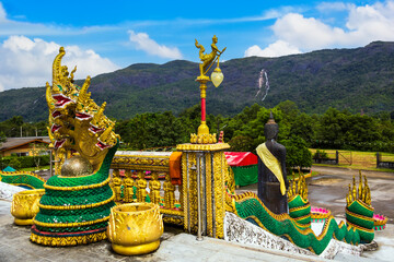 Baan Ngao Temple in Ranong Thailand with blue sky and mountain
