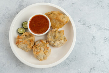 Batagor, made from fish or chicken dumpling, tofu, tapioca flour served with peanut sauce. Indonesian food
