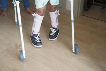 Young Child Using Walker for Supportive Mobility Indoors