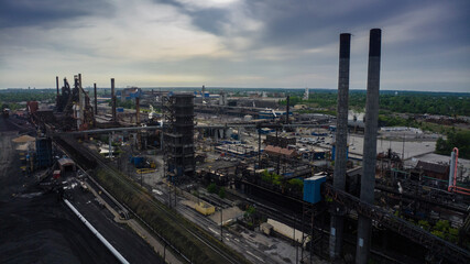 Obraz premium MAY 10, 2023 - GRANITE CITY, ILLINOIS, USA - aerial view of US Steel factory with smokestacks, Granite City, Illinois