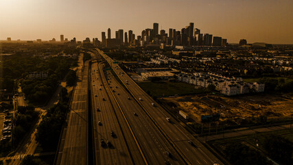 JULY 16, 2023, silhouette aerial view of Houston, Texas skyline at sunset