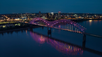 JULY 6, 2023 - MEMPHIS, TN, USA - Hernando De Soto Bridge LIGHT SHOW - Memphis, Tennessee over Mississippi River at night