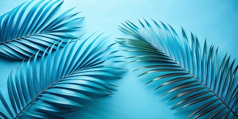 Fototapeta premium Aesthetic Aerial Photography of Three Blue Palm Leaves on Light Blue Background for Nature and Design Inspiration in Modern Decor and Wallpaper