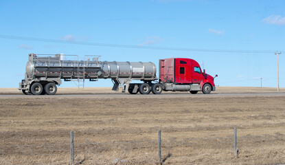 Heavy Cargo on th eroad. A truck hauling freight along a highway. Taken in Alberta, Canada