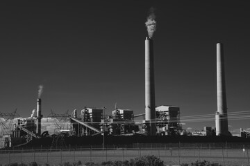 Fototapeta premium OCTOBER 17, 2023 - GALLUP, NM, USA - Escalante Generating Station smoke stacks
