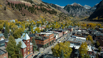 OCTOBER 14, 2023 - TELLURIDE COLORADO, USA - aerial view of Main Street old western ski town of Telluride in autumn color surrounded by mountains