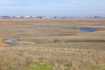 An image of open space and marshes in Suisun City. Travis Air Force Base can be seen in the distance. 