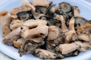 sashimi of conch and sea cucumber on the dish