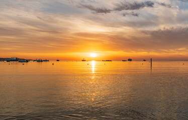 Naklejka premium Beautiful red and orange sunrise over the sea.
