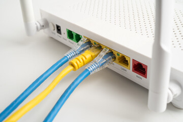Ethernet cable with wireless router connect to internet service provider internet network.