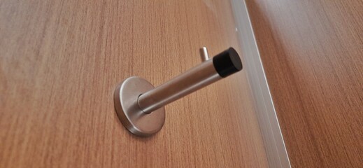 Door stopper wall. Stainless magnetic door in toilet mall Indonesia