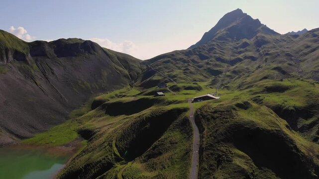 Scenic sunset over Eisee lake and summit of Brienzer Rothorn, Switzerland, aerial view