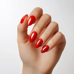 Freshly manicured red nails on woman hand, showcasing elegance and style