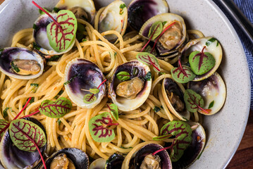 Spaghetti alle vongole is a pasta dish consisting of spaghetti cooked with fresh clams, originating in the coastal regions of southern Italy