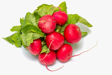 A bunch of radishes are sitting on a white background