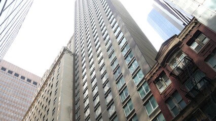 Fototapeta premium New York City Lower Manhattan, Downtown Financial District architecture, United States. High-rise skyscrapers, residential and office buildings, USA. American urban street, real estate, realty in NYC.