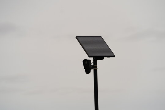 Flock safety police law enforcement license plate reader set up outside to help catch vehicle speeders.