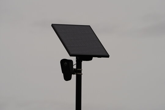 Flock safety police law enforcement license plate reader set up outside to help catch vehicle speeders.