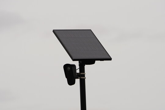 Flock safety police law enforcement license plate reader set up outside to help catch vehicle speeders.