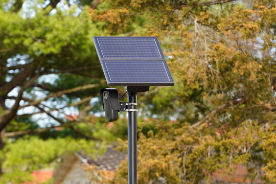 Flock safety police law enforcement license plate reader set up outside to help catch vehicle speeders.