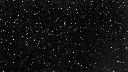 Minimalist, high-resolution black and white photograph of abstract snowflakes falling against a starry night sky. The image features a flat lay, top-down perspective, and a grainy texture, creating a 