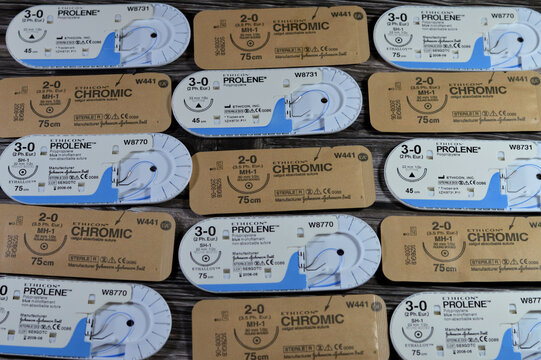 Cairo, Egypt, October 13 2024: Surgical sutures of ETHICON Prolene blue color suture 3-0 Polypropylene non absorbable and Chromic surgical gut sutures, catgut absorbable suture, selective focus