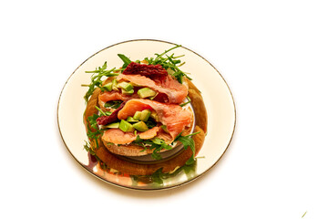 A plate of food with a sandwich and a salad on it