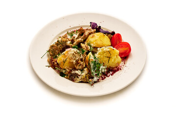 A plate of food with a variety of vegetables and meat