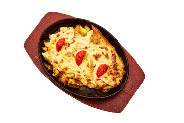 A plate of food with a red bowl on top