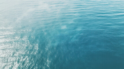 Calm and Serene Ocean Water Surface with Soft Ripples and Sparkling Sunlight Reflections, Ideal for Tranquil Seascapes and Nature-Themed Designs