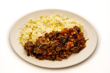 A plate of food with rice and meat on it