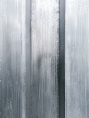 A textured surface featuring vertical lines of condensation, creating a cool, abstract pattern reminiscent of frosted glass.